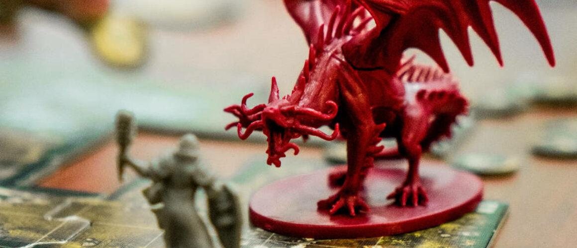 A photo of a dragon mini on a game board