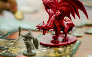 A photo of a dragon mini on a game board